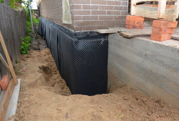 SJ Waterproofing Pros technician performing targeted Vapor Barrier Installation assessment in Floral Park, NY